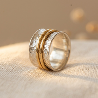 Zilveren brede spinner ring met gouden banden