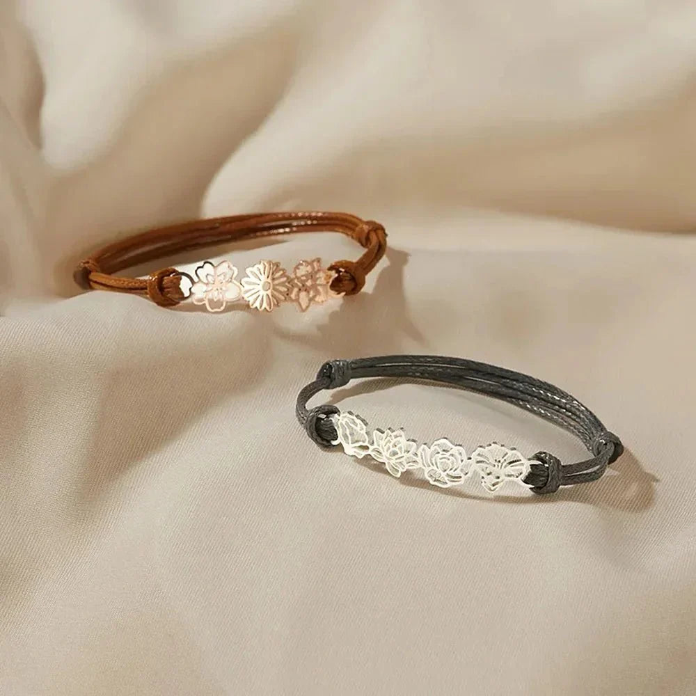 Bruine koord armband met gouden bloemen