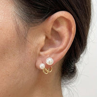 Gouden oorbellen met dubbele parels